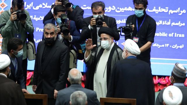 The hard-line Brahim Leahy (the person who raises his hand in the picture) has just taken office as the Iranian president.