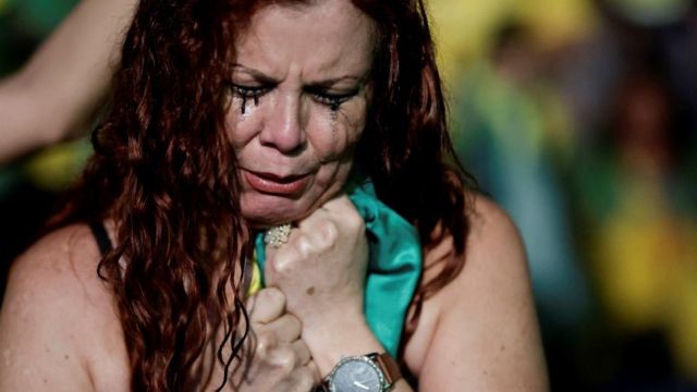 A supporter of Brazil's President and presidential candidate Jair Bolsonaro reacts, during the Brazilian presidential election run-off, in Brasilia, Brazil October 30, 2022