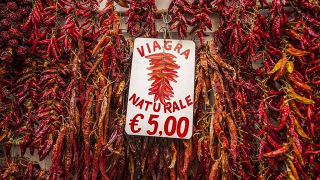 A sign among 'natural viagra' red chili peppers