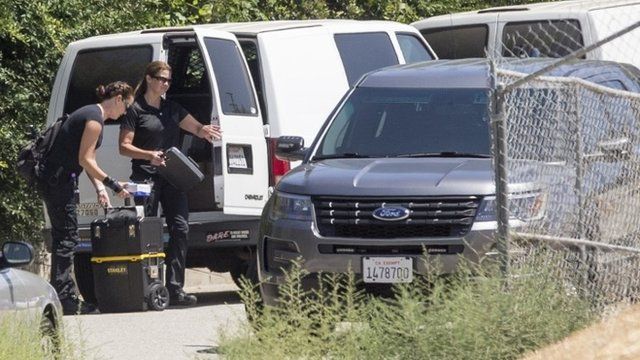 Los Angeles Police Department crime scene technician arrive at the home of singer Chris Brown following an early morning 911 call from a woman there