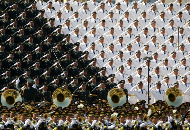 Military band sing and salute at the Tiananmen Square at the beginning of the military parade marking the 70th anniversary of the end of World War Two, in Beijing, China, 3 September 2015.