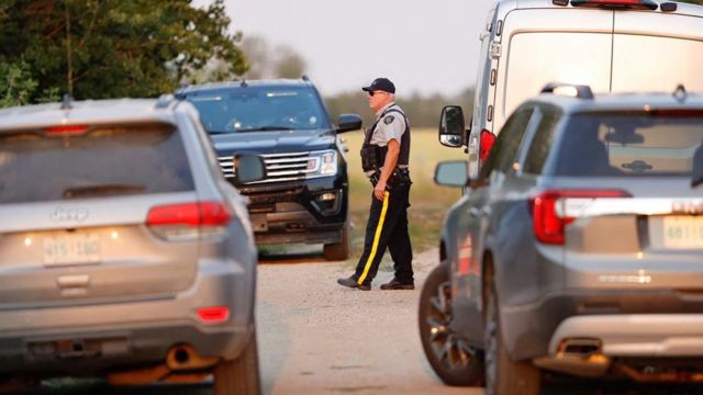 A Royal Canadian Mounted Police (RCMP) officer arrives at the crime scene