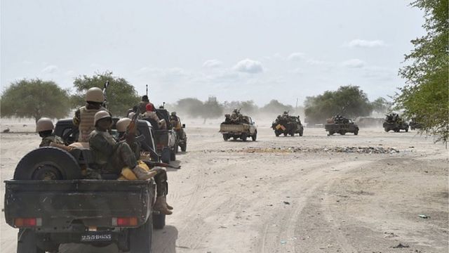 Niger soldiers ride in a military vehicle on May 25, 2015 in Malam Fatori, in northern Nigeria, near the border with Niger.