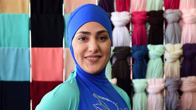 A Muslim model wears a burkini swimsuit