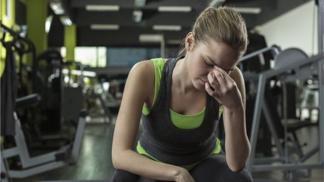 A woman feels bad after exercising