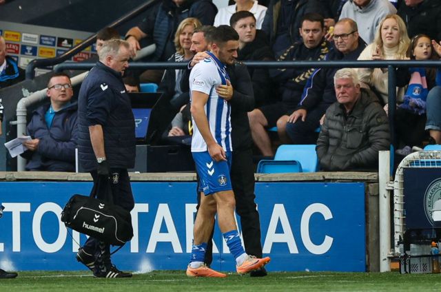 Kyle Magennis with his Kilmarnock manager Derek McInnes