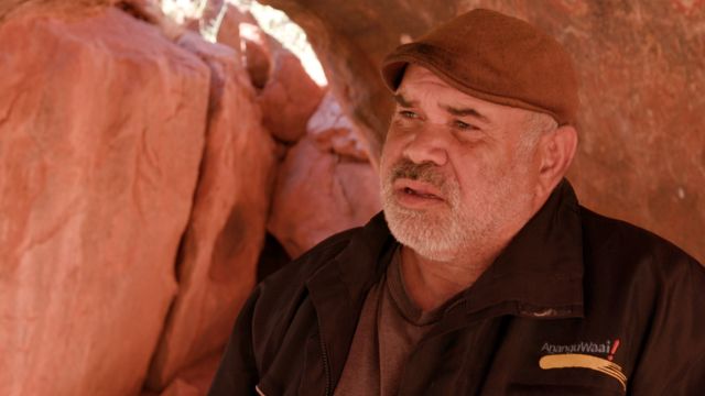 Sammy Wilson in a cave at Uluru