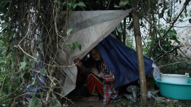 A refugee from Myanmar rests in a temporary shelter in Wanding, in China"s southwest Yunnan province on November 30, 2016.