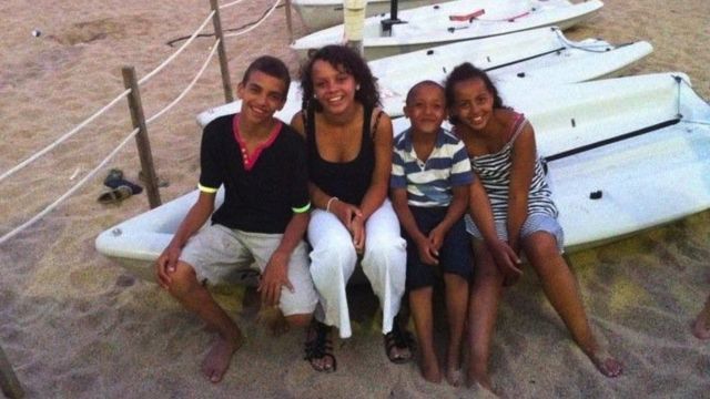 Alexandra with her siblings, on holiday