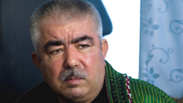 Afghan General Abdul Rashid Dostum speaks during an interview at his palace in Shibergan, in northern Afghanistan