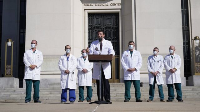 Dr. Conley (middle) told reporters that the president's viral load is dropping