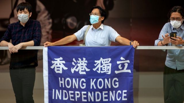 Pro-democracy activists protest against China in a shopping mall in Hong Kong