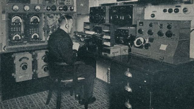 A Marconi wireless operator receiving wireless messages as the Empress of Britain crosses the Atlantic in around 1934