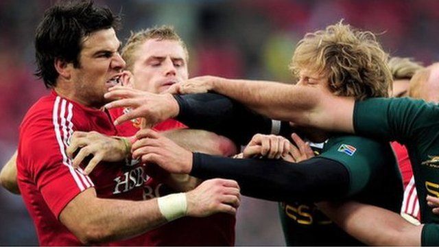 Mike Phillips scuffles with South African players during the third Lions Test in 2009