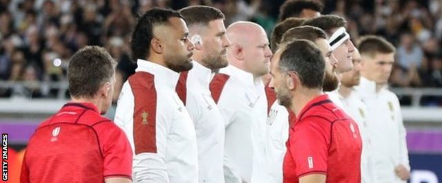 Referee Nigel Owens and his team ushered England's players back inside their own half