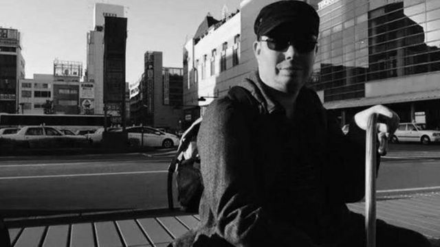 迈克尔·佩吉特是一位生活在神户的英国学者，他患有脑瘫。(photo:BBC)