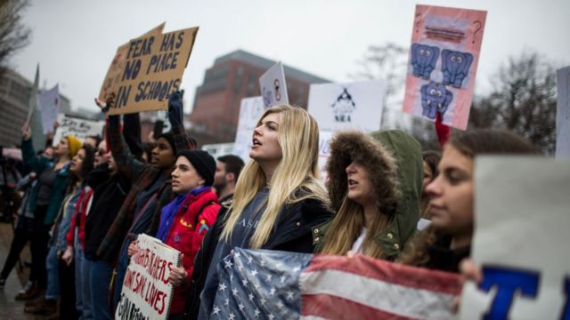 Demonstrators chant during a 'lie-in' demonstration supporting gun control reform near the White House on February 19, 2018 in Washington, DC. According to a statement from the White House, 'the President is supportive of efforts to improve the Federal background check system.', in the wake of last weeks shooting at a high school in Parkland, Florida