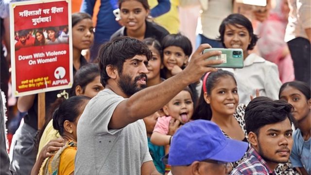 Wrestler Bajrang Punia and children during the wrestlers' protest, at Jantar Mantar, on May 21, 2023 in New Delhi, India. (Photo by Sanjeev Verma/Hindustan Times via Getty Images)