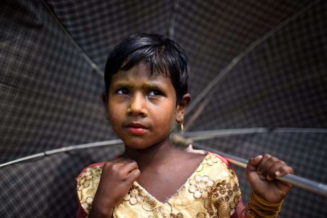 Rohingya refugee Zinu Ara, aged 4, poses for a photograph as she wears thanaka paste at Balukhali camp in Cox's Bazaar, Bangladesh