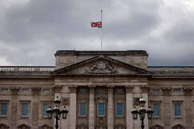 The union flag flies at half-mast atop Buckingham Palace