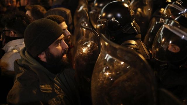 Protesters clash with riot police in Tbilisi.