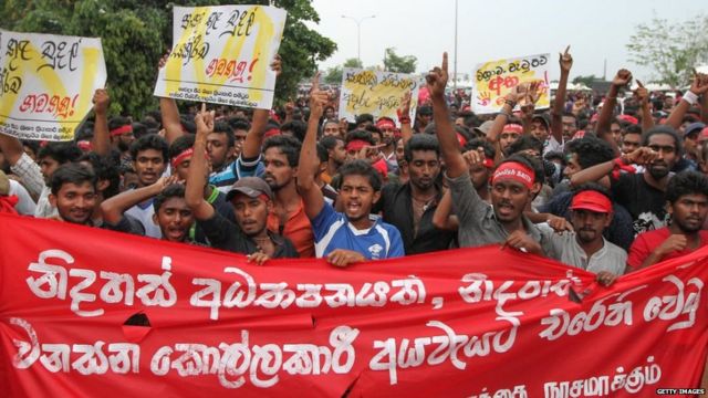 COLOMBO - SRI LANKA - NOVEMBER 29 : Sri Lankan university students shout slogans during a protest march urging the government to guarantee education rights, in Colombo, Sri Lanka, November 29, 2016 . Thousands of students protested near the Sri Lankan Parliament Tuesday against the Sri Lankan government's plans to introduce private medical universities. (Photo by Chamila Karunarathne/Anadolu Agency/Getty Images)