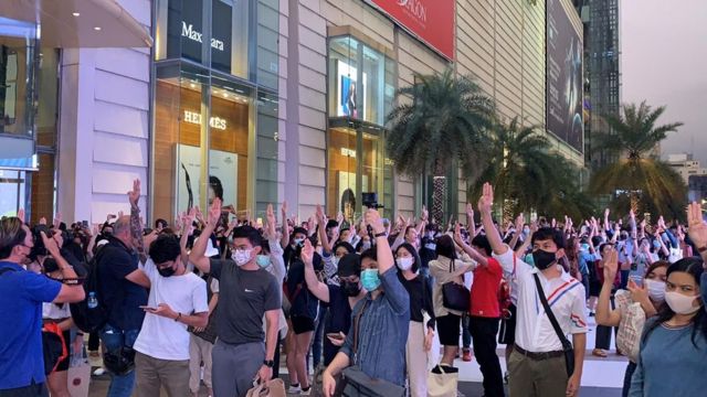 People gathered to lift a 3-inch symbol during the national anthem.