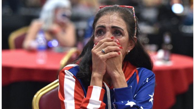 A voter in Las Vegas, Nevada, eagerly watches the vote count.