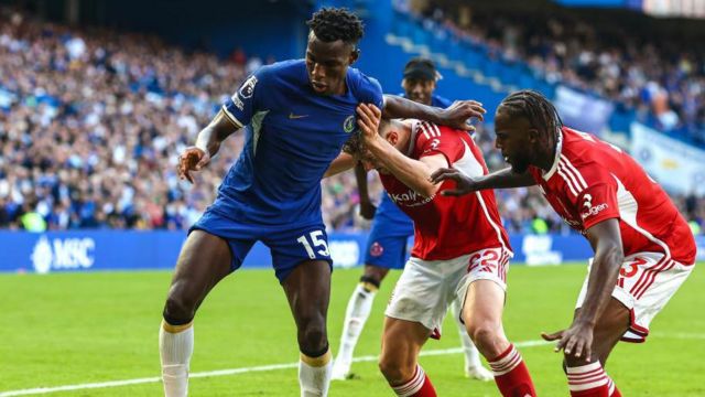 Chelsea's Nicolas Jackson holds off Nottingham Forest's Ola Aina
