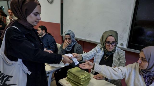 A woman registers to vote in the general election at a polling station in Istanbul, Turkey on May 14, 2023.