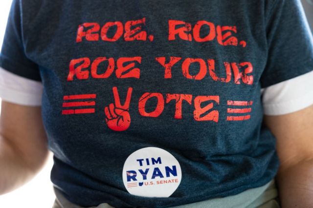 Amy Cox, the Democratic candidate from Ohio, carries the pro-Roe vs.  Wade in Trenton, Ohio on October 23, 2022.