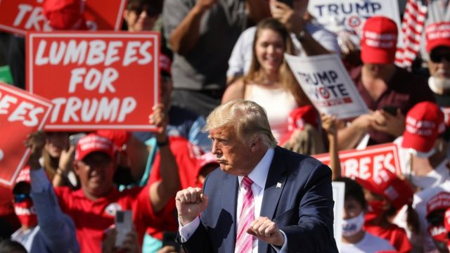 Donald Trump dances in front of a cheering crowd