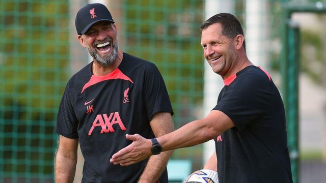 John Achterberg and Jurgen Klopp smile on the training ground