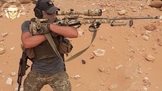 A Wagner snipe in Libya is seen in a desert environment with a specialised sniper rifle