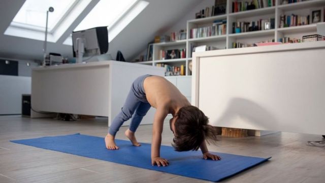 A child doing yoga exercises