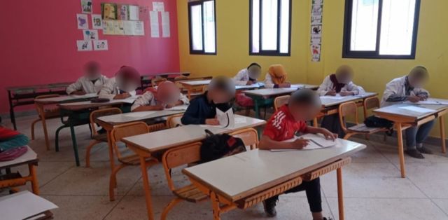 Children study in a school classroom