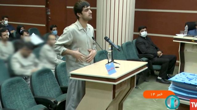 Mohammad Mehdi Karami addresses the judge in court.