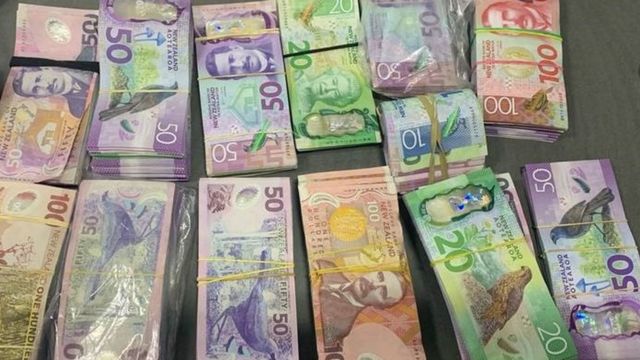 NZ$100,000 seized by police officers.