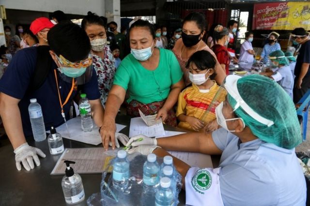 Migrant workers from a seafood market are seen before being assessed, amid the coronavirus disease (COVID-19) outbreak, at a seafood market in Thailand's Samut Sakhon province on 19 December 2020