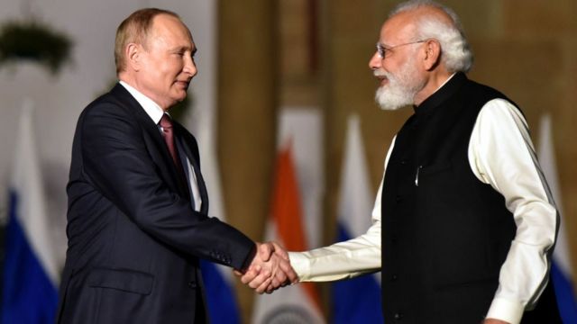 Indian Prime Minister Narendra Modi shakes hands with Russian President Vladimir Putin during their meeting at Hyderabad House, on December 6, 2021 in New Delhi, India.