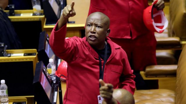 Opposition Economic Freedom Fighters (EFF) party leader Julius Malema objects as South African President Cyril Ramaphosa attempts to deliver his State of the Nation address at parliament in Cape Town,