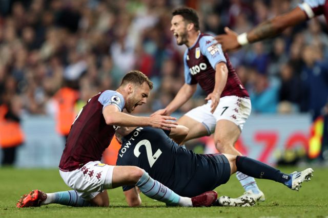 Matthew Lowton is sent for a tackle on Callum Chambers