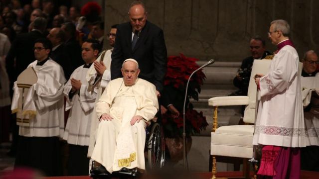 Pope coming to baslica in wheel chair
