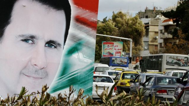 A photo taken on March 4, 2015 shows a banner bearing a portrait of Syrian President Bashar al-Assad in a street in the city of Damascus.