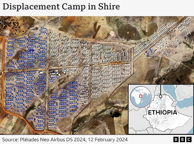 Satellite image of camp with blue and white tents