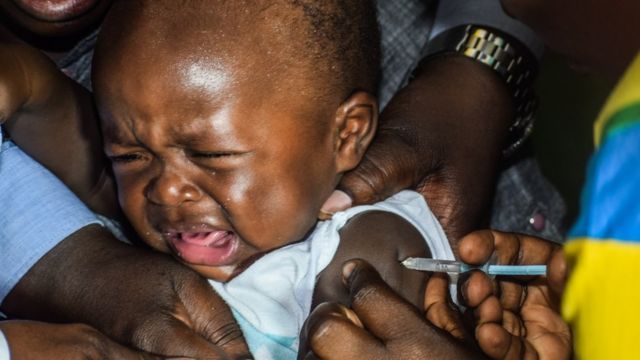 A child being injected with malaria vaccine in KENYA