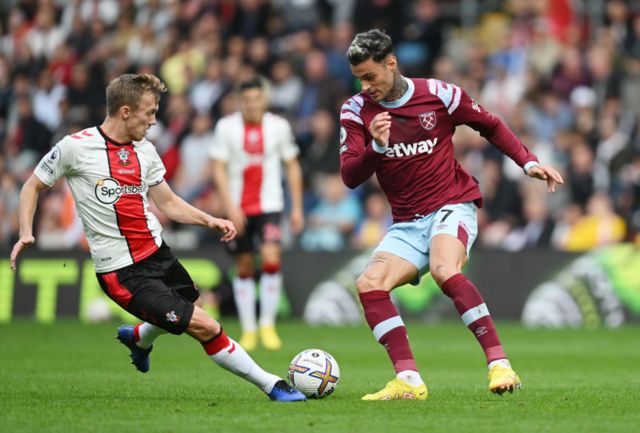 Gianluca Scamacca of West Ham United is challenged by James Ward-Prowse of Southampton during the Premier League match between Southampton FC and West Ham United