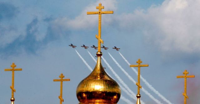 росія