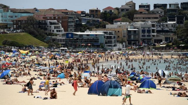 Crowds flock to the beaches