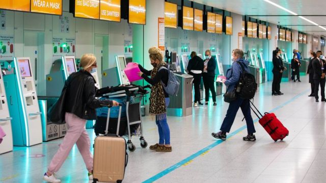 Passengers check in for the first holiday and leisure flight to take-off at Gatwick Airport, as easyJet relaunch flights from the UK to green-lit destinations today, for the first time this year